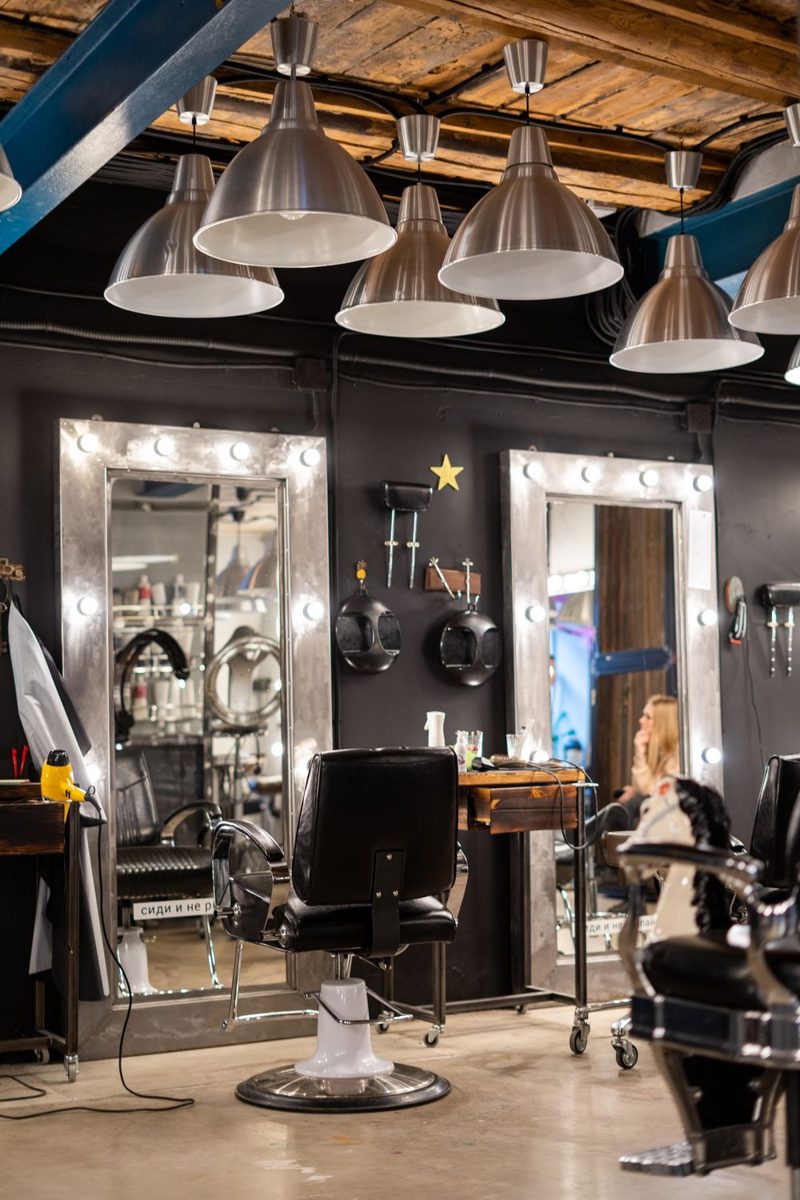Inside the salon: styling chairs, mirrors and warm lighting